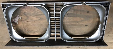 HEADLIGHT BEZEL ,LEFT USED 73 IMPALA