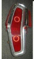 TAIL LIGHT ASSEMBLY, LH, 64 CAT STARCHIEF, HOUSING LENS BEZEL EXTENSION, USED