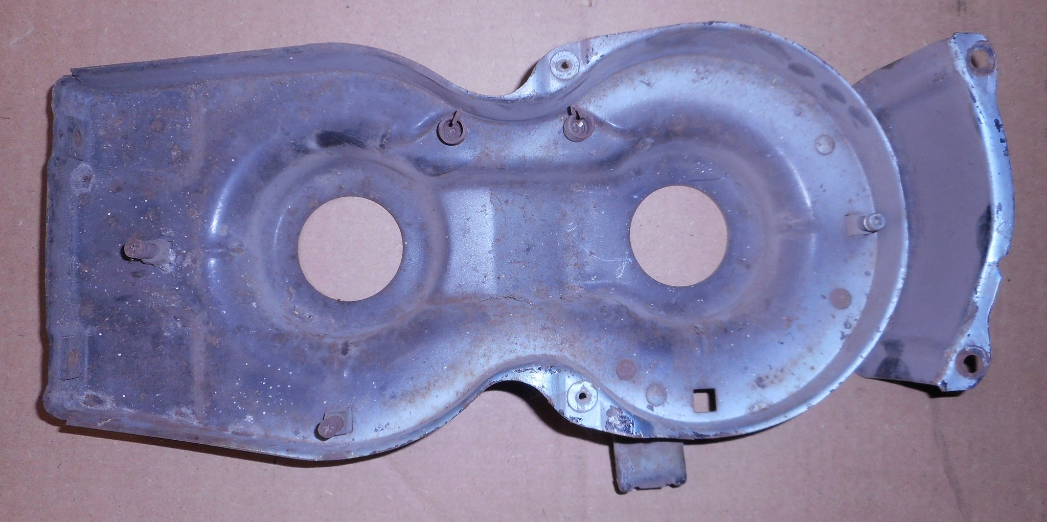 HEADLIGHT MOUNTING PLATE ,LEFT USED 64 CHEVELLE