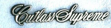 FENDER EMBLEM (CUTLASS SUPREME) 82-88, GLUE ON SCRIPT, USED