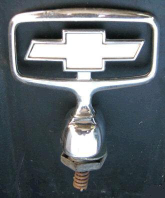 HOOD EMBLEM, "BOWTIE", 91-5 CP IM, ORNAMENT SPRING LOADED, USED