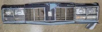 FRONT HEADER PANEL ASSEMBLY ,USED 77 OLDS DELTA 88