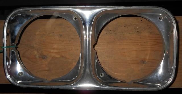 HEADLIGHT BEZEL OR DOOR LEFT SIDE