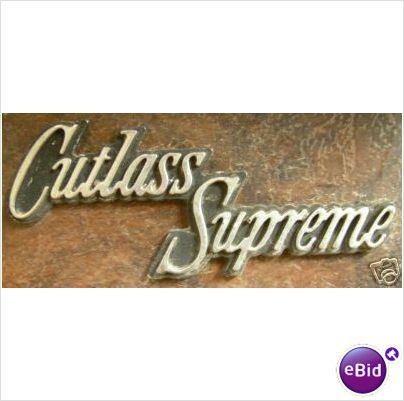 GLOVE DOOR EMBLEM, (CUTLASS SUPREME) 70-2 USED