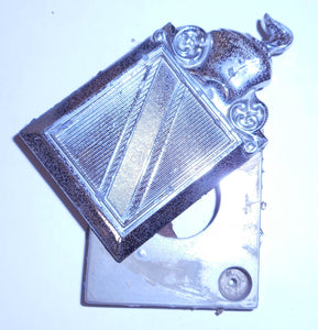 TRUNK LOCK EMBLEM, SWIVEL, USED, 76-77 REGAL