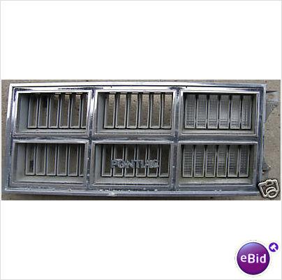 FRONT GRILLE & PARK LIGHT, LH, 77 VENTURA, USED
